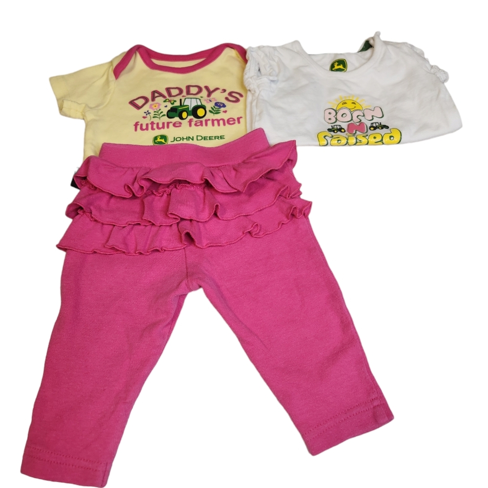 The 2 shirts are 3 months, and the pink pants are 0-3 months.